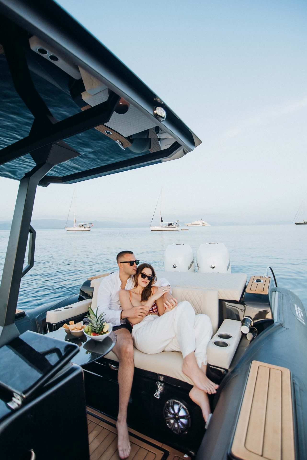 Romantic Sunset Experience in Corfu - Couple Enjoying Fresh Fruit on a Boat Trip